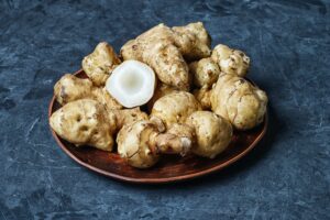 Jerusalem artichokes on dark background